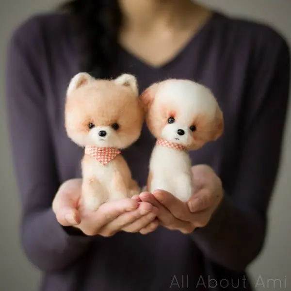 Two cute crochet amigurumi dogs with a fluffy look