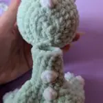 Crocheted dinosaur head and back assembly step image
