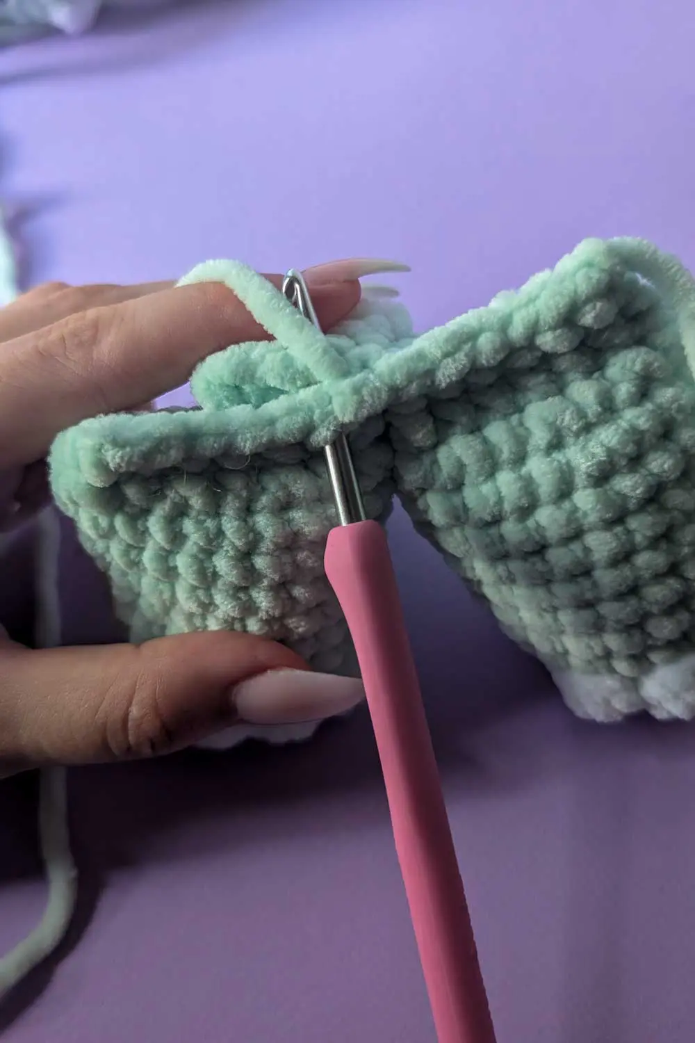 Image showing how to attach legs for a dinosaur lovey