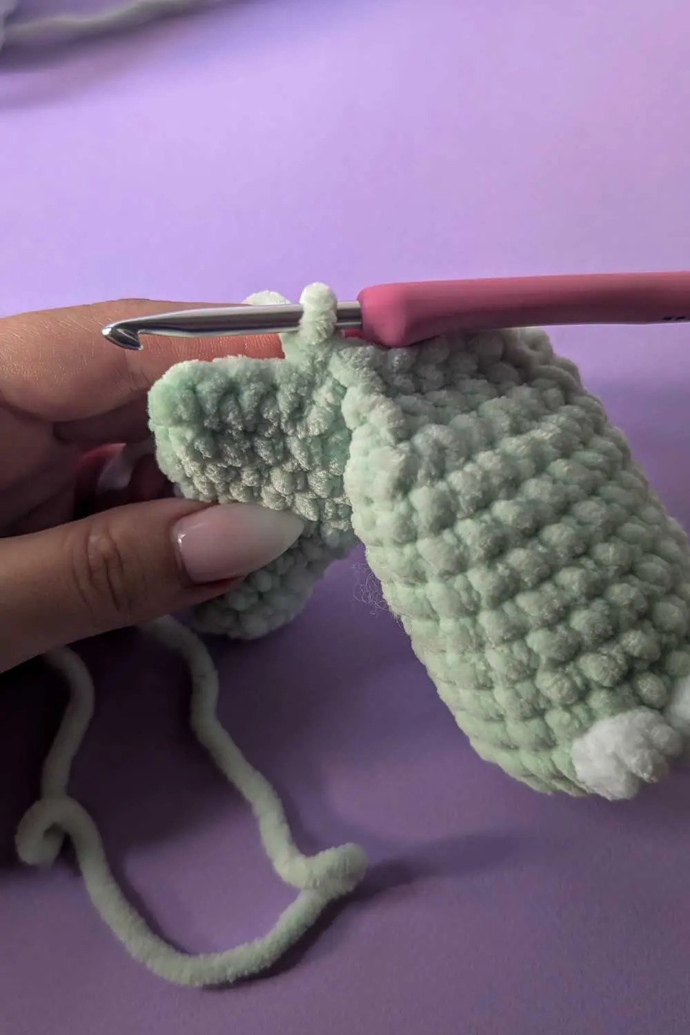 Image showing how to attach legs for a dinosaur lovey