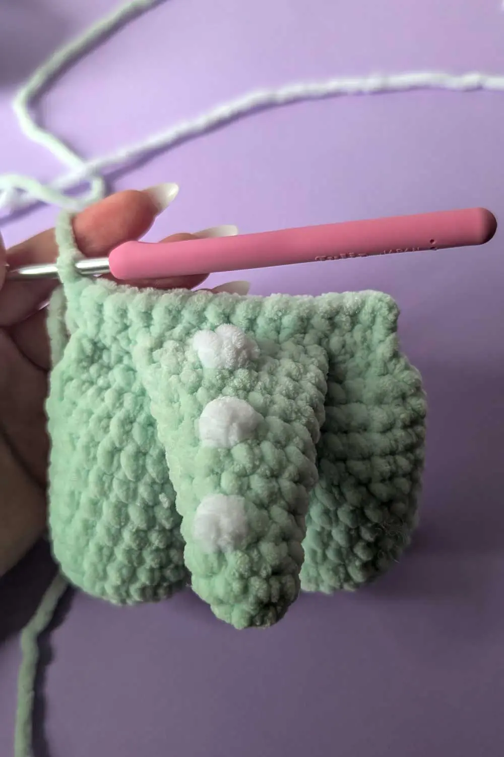 Crocheted dinosaur lovey in progress