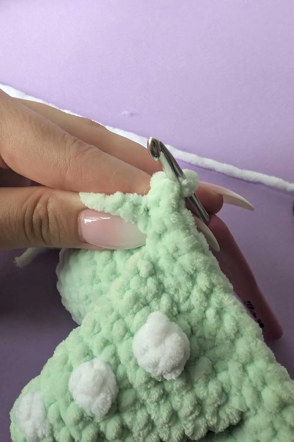 Crocheted dinosaur tail in progress