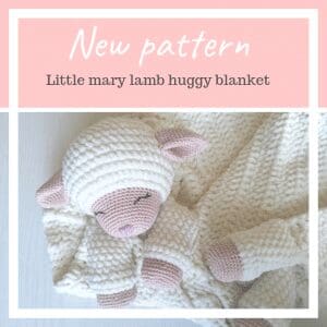 A soft, knitted white and pink lamb plush is cuddled up in a matching textured baby security blanket. Text above reads New pattern - Little mary lamb huggy blanket on a pink background.