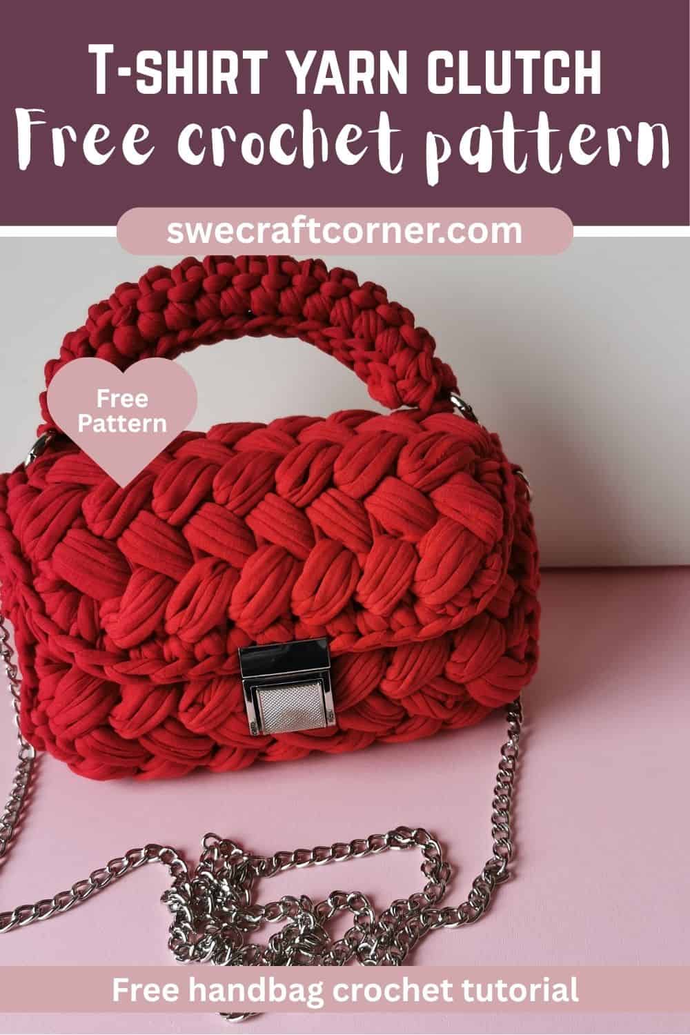 A red crochet clutch with a chunky texture, crafted from T-shirt yarn and finished with a silver chain strap, is displayed on a pink surface, showing a free crochet pattern from swecraftcorner.com.