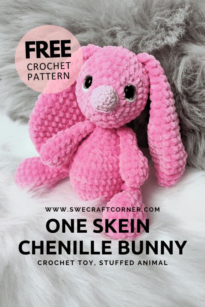 A pink crochet bunny plush toy sits on a white surface with a fluffy gray background. Text reads: Free crochet pattern. www.swecraftcorner.com. One Skein Chenille Bunny. Crochet stuffed animal.