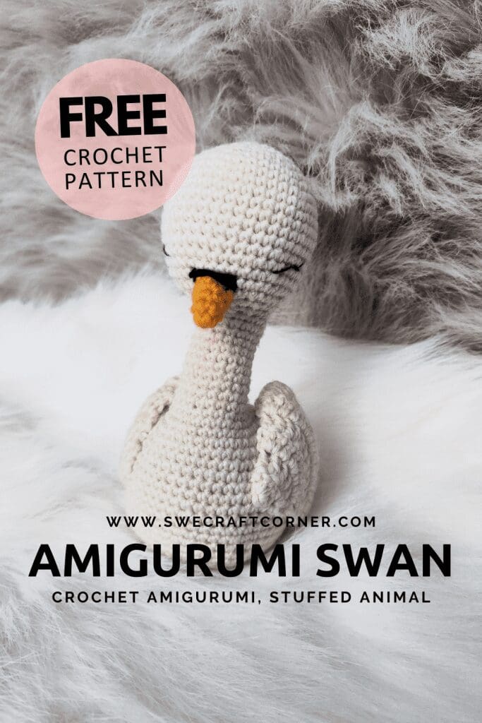 A crocheted amigurumi swan with a yellow-orange beak sits on a fluffy white and gray surface. Text reads: FREE CROCHET PATTERN, www.swecraftcorner.com, Amigurumi Swan, Crochet Soft Toys, Stuffed Animal.