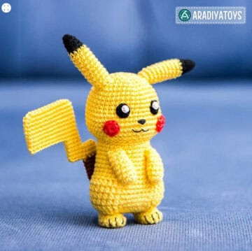 Crochet pikachu on blue background
