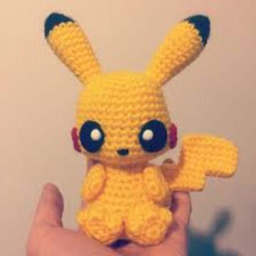 Handmade Pikachu crochet plush toy inspired by Pokémon, perfect for collectors and fans.