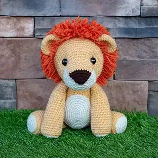 Crocheted lion with orange mane