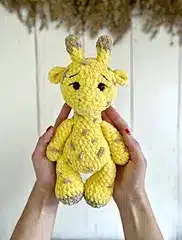Yellow crochet giraffe plush toy