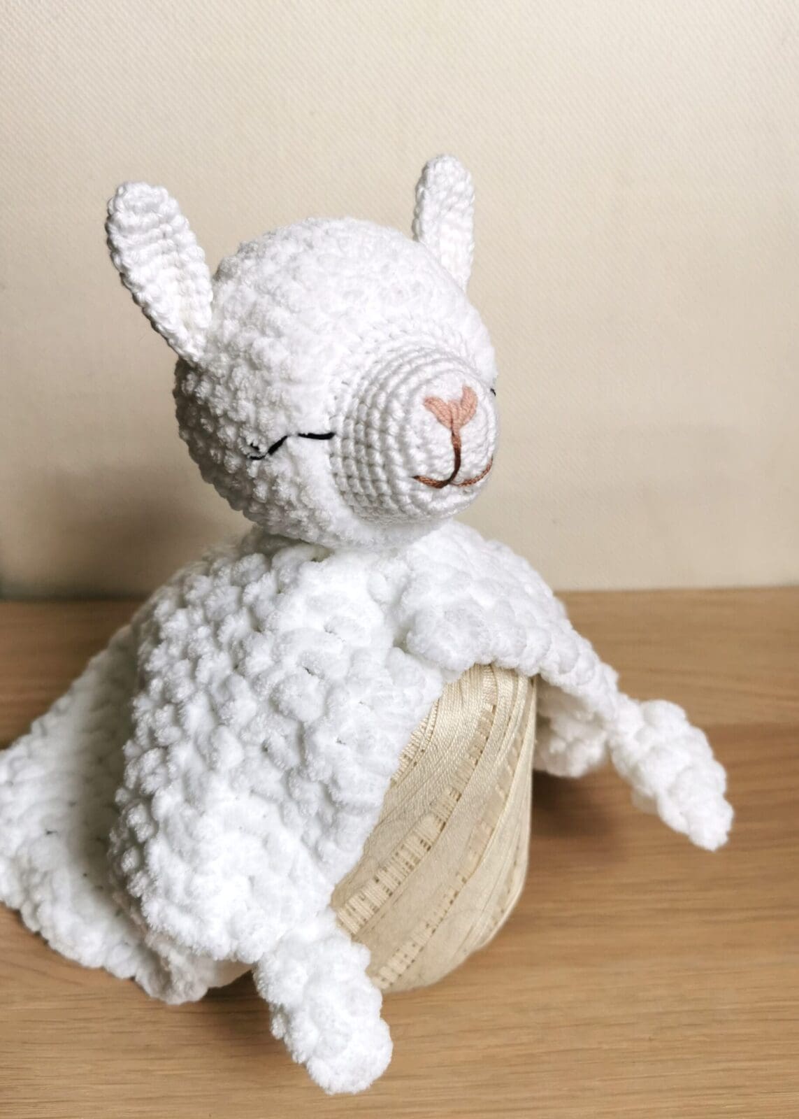 White crocheted baby lovey llama with blanket