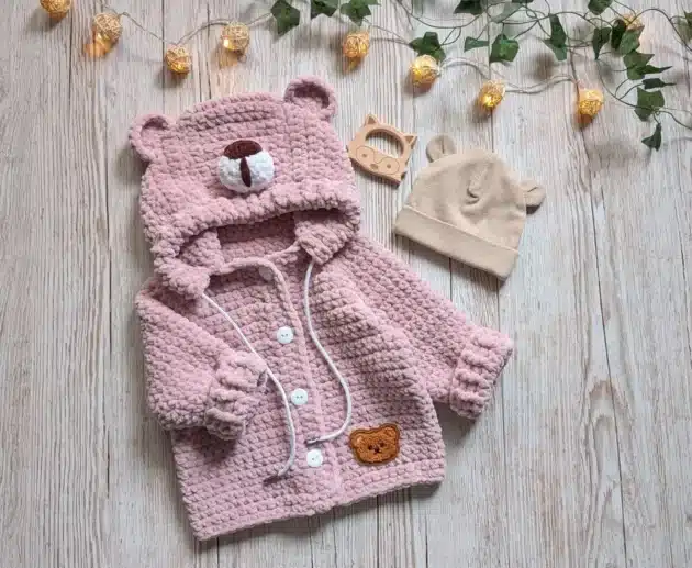Bearly Adorable Jacket – A Crochet Baby Hoodie Pattern you'll LOVE Adorable crochet baby jacket in pink plush yarn with hood and bear ears – cozy crochet baby coat pattern available as digital PDF.