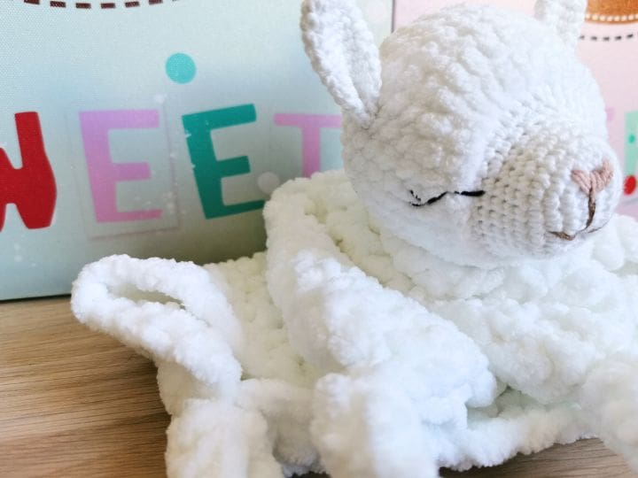 White crochet baby lovey with llama head