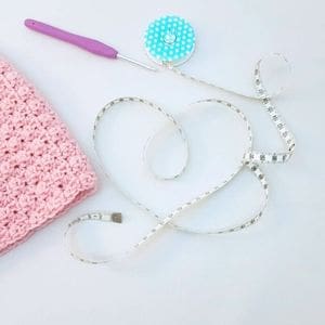 Crochet materials with measuring tape.