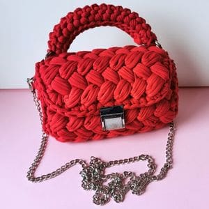 red crochet clutch made with t-shirt yarn from this free crochet pattern
