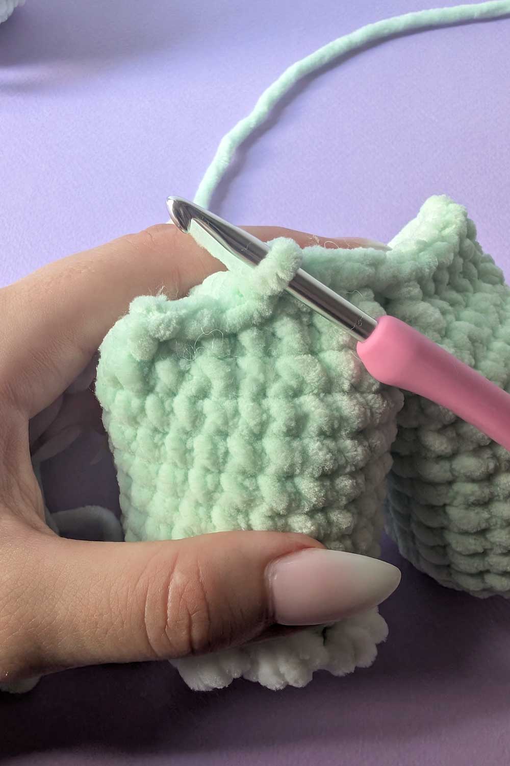 Image showing how to attach legs for a dinosaur lovey