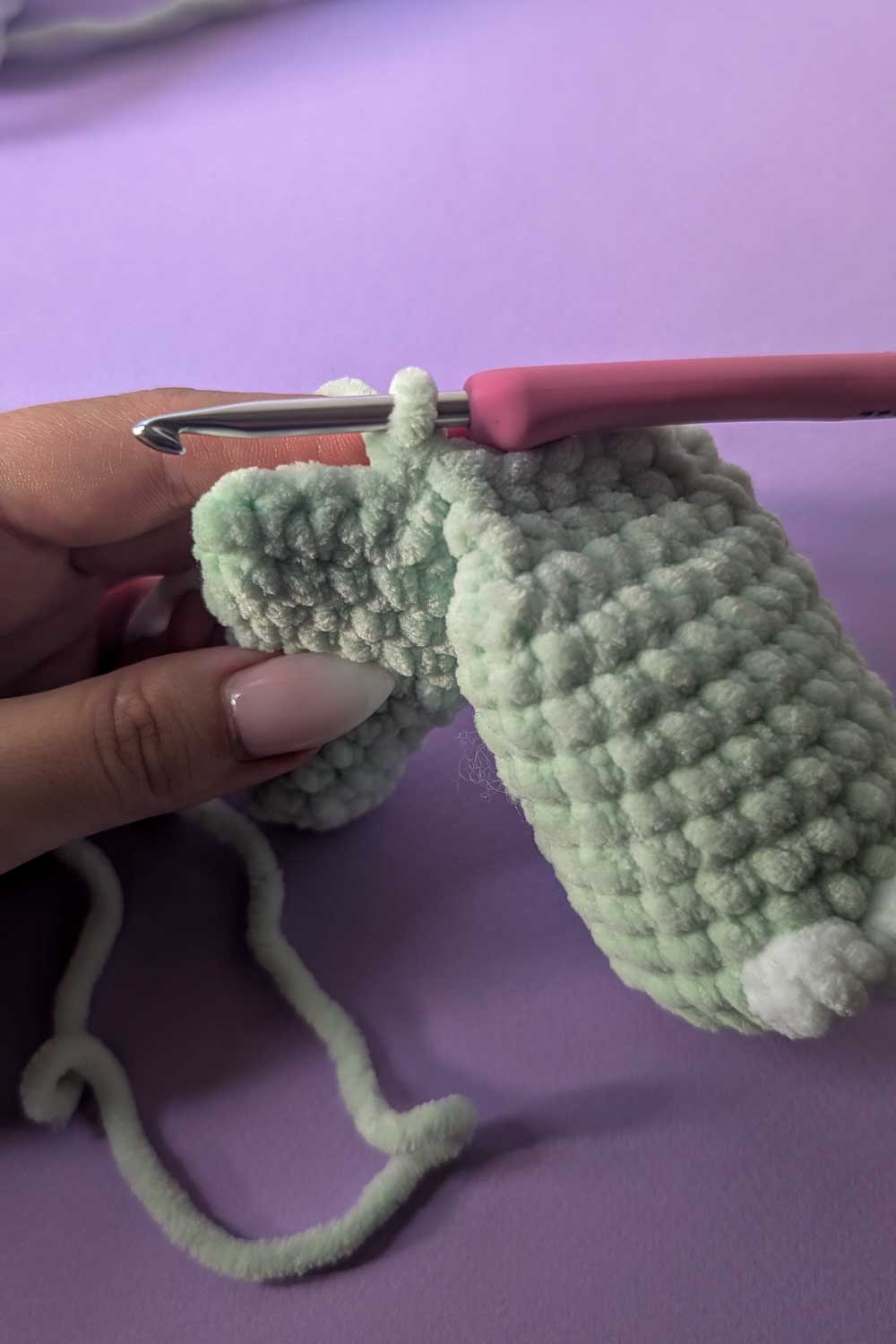 Image showing how to attach legs for a dinosaur lovey