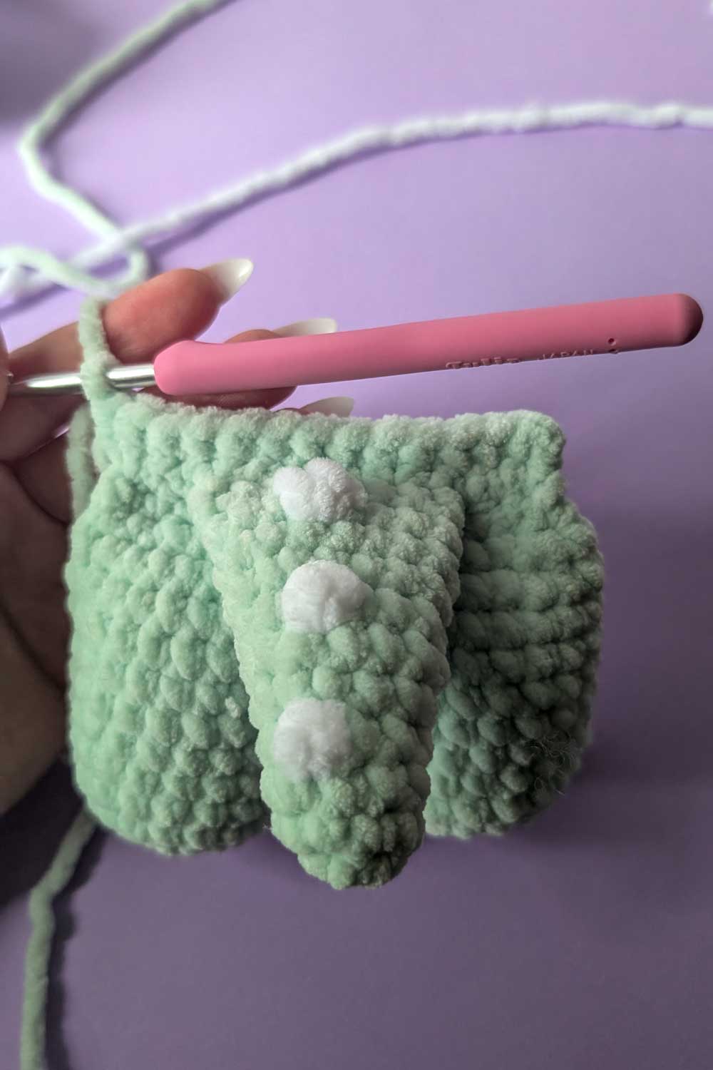 Crocheted dinosaur lovey in progress