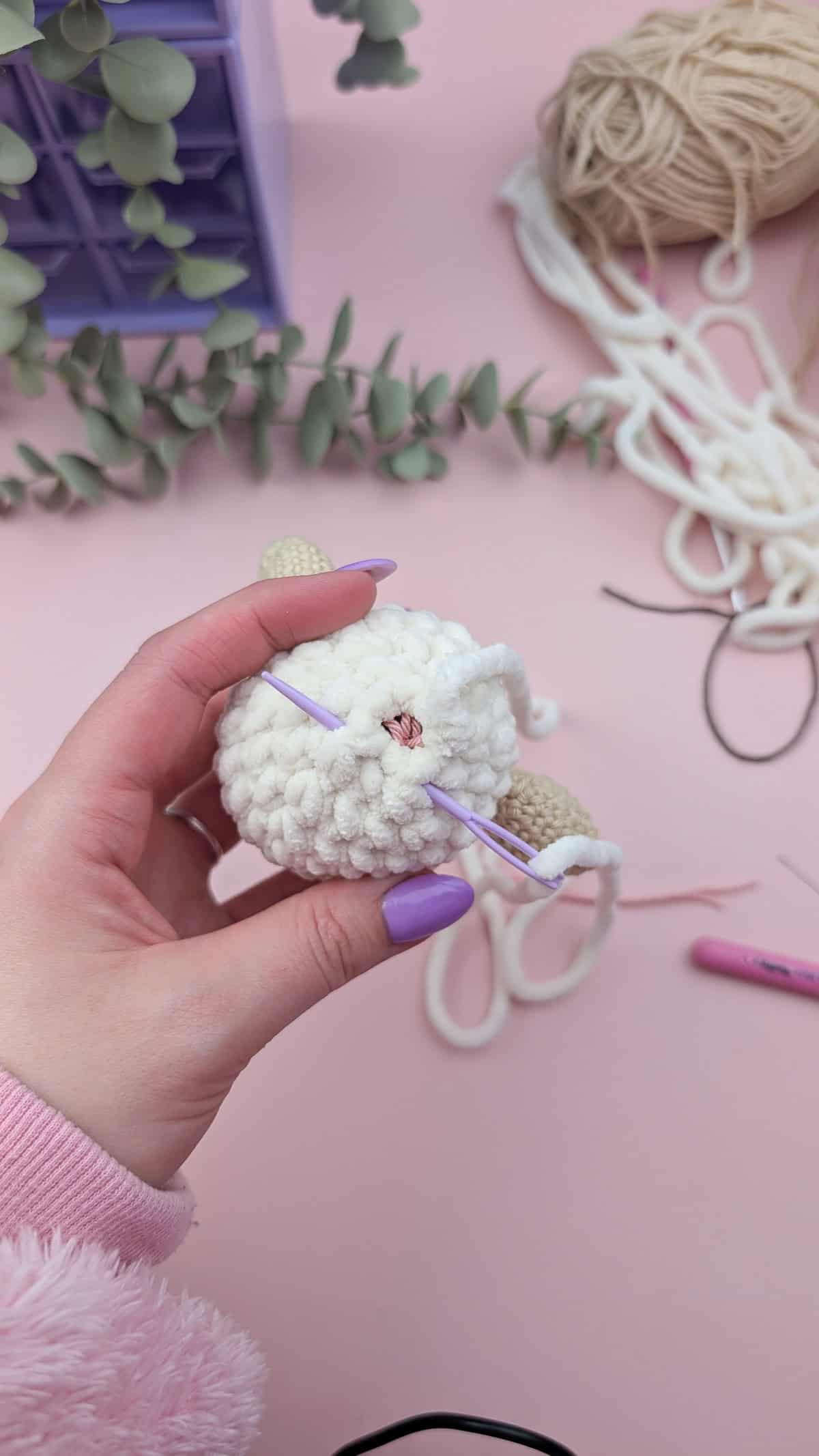 a needle used to sew the back of the lovey head closed